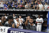 Miami Marlins pitcher Sandy Alcantara waves to the crowd as he is acknowledged during the fourth inning of a baseball game against the Atlanta Braves, Wednesday, Oct. 5, 2022, in Miami. (AP Photo/Wilfredo Lee)