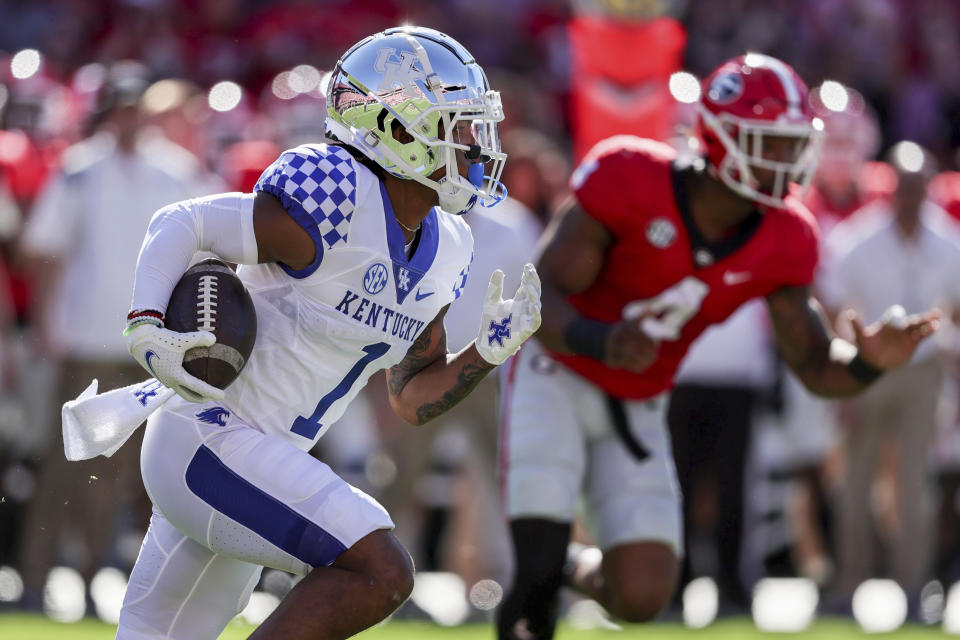 Kentucky wide receiver Wan'Dale Robinson (1) carries the ball against Georgia during the first half of an NCAA college football game Saturday, Oct. 16, 2021 in Athens, Ga. (AP Photo/Butch Dill)