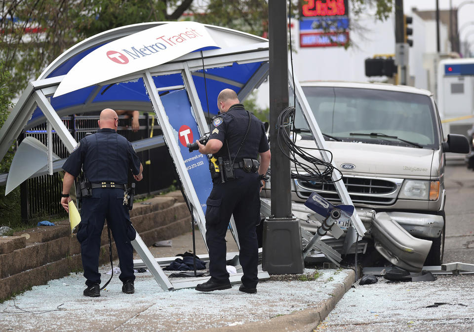 At least six people were hurt, including three critically, when a van slammed into a crowded bus stop shelter in north Minneapolis. All six were transported to hospitals. Metro Transit spokesman Howie Padilla says police took the driver of the van into custody following the crash about 9:30 a.m. Tuesday, July 9, 2019. (David Joles/Star Tribune via AP)