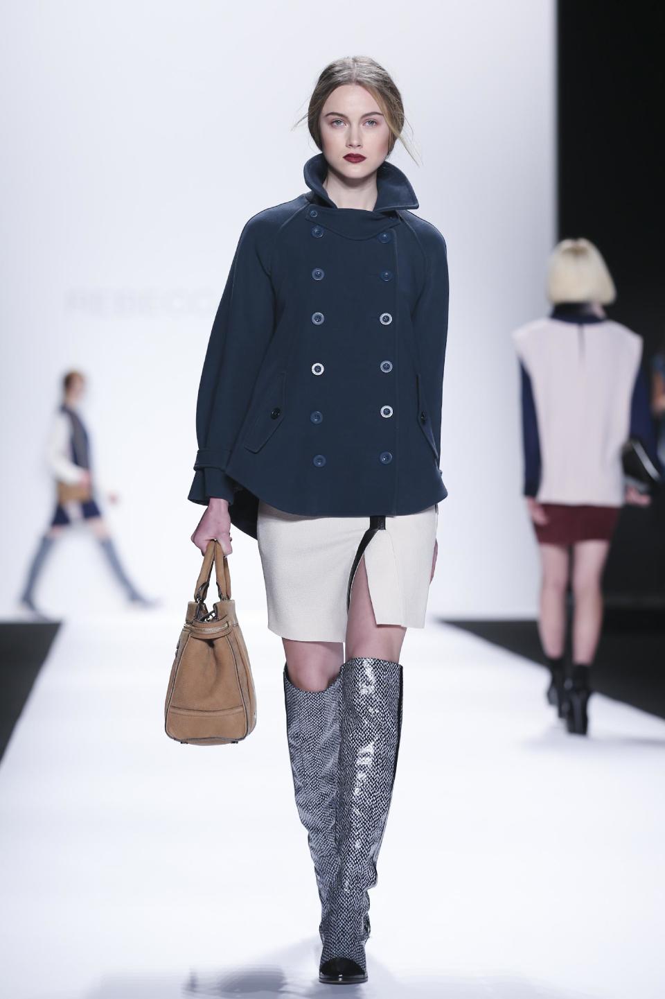 The Rebecca Minkoff Fall 2014 collection is modeled during Fashion Week, Friday, Feb. 7, 2014, in New York. (AP Photo/John Minchillo)