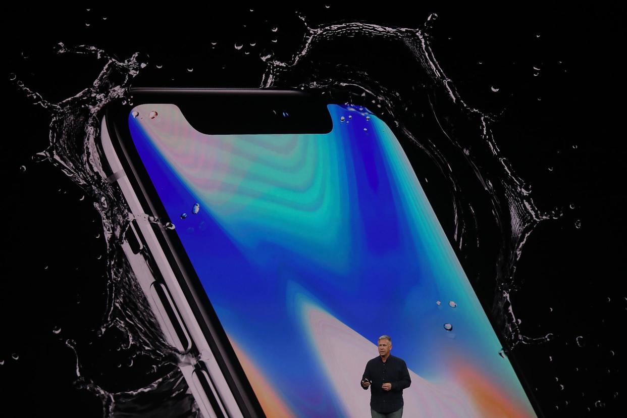 Apple head of marketing Phil Schiller introduces the new iPhone X during an Apple special event at the Steve Jobs Theatre on the Apple Park campus on September 12, 2017 in Cupertino, California: Justin Sullivan/Getty Images