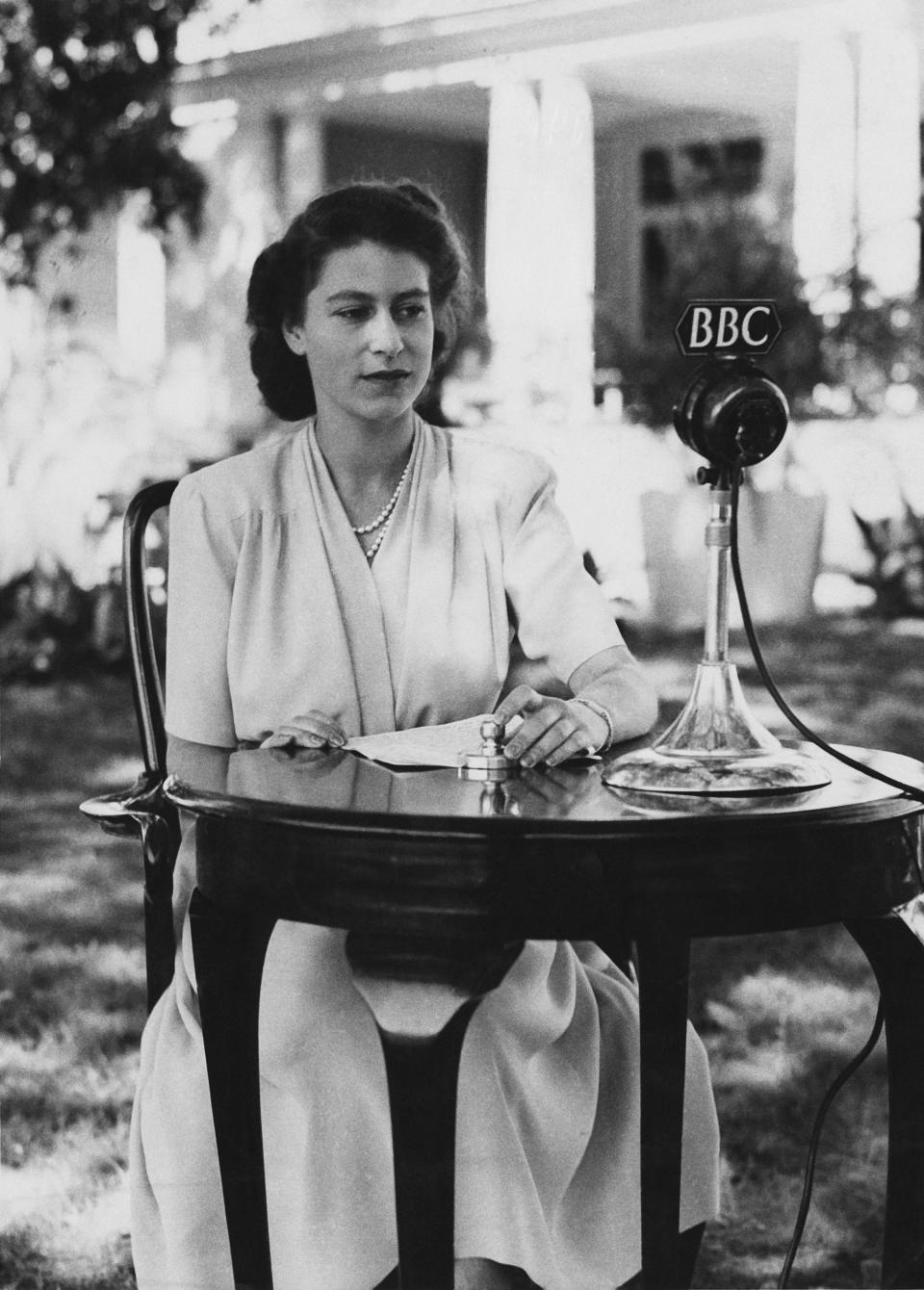 The then Princess Elizabeth makes a broadcast from the gardens of Government House in Cape Town, South Africa, on her 21st birthday, 21 April 1947.