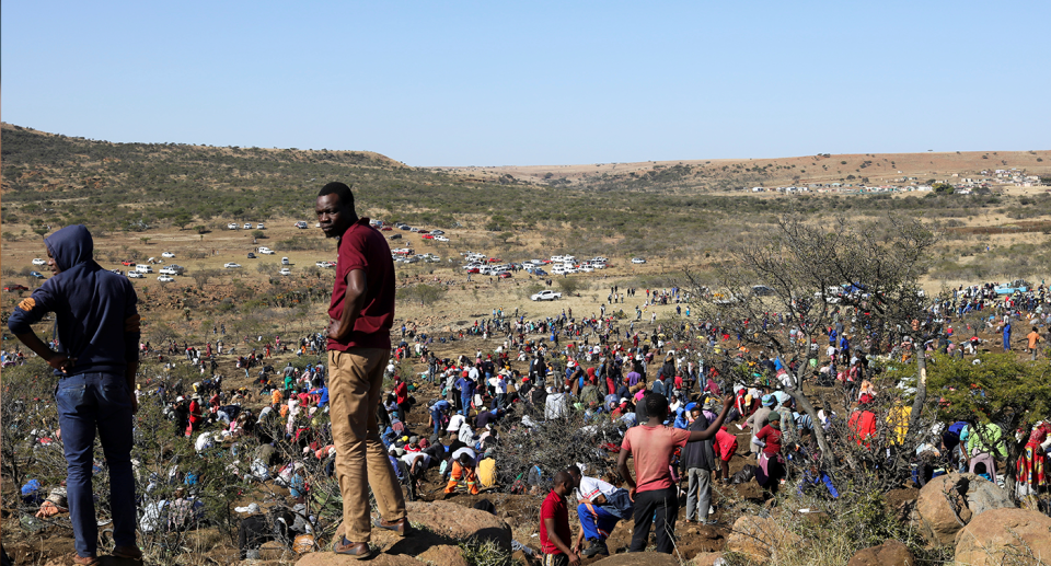 A crowd of people in the desert in South Africa. Source: Reuters