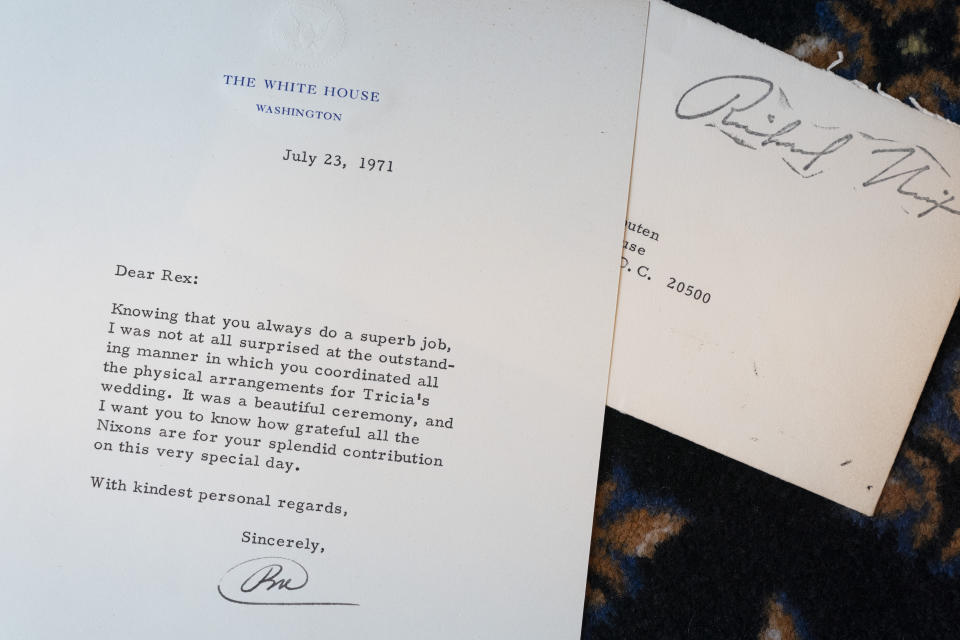 A letter from President Richard Nixon to White House Head Usher Rex Scouten is seen inside of Tricia Nixon's 1971 wedding planner, Tuesday, Oct. 25, 2022, at the White House Historical Association in Washington. (AP Photo/Jacquelyn Martin)