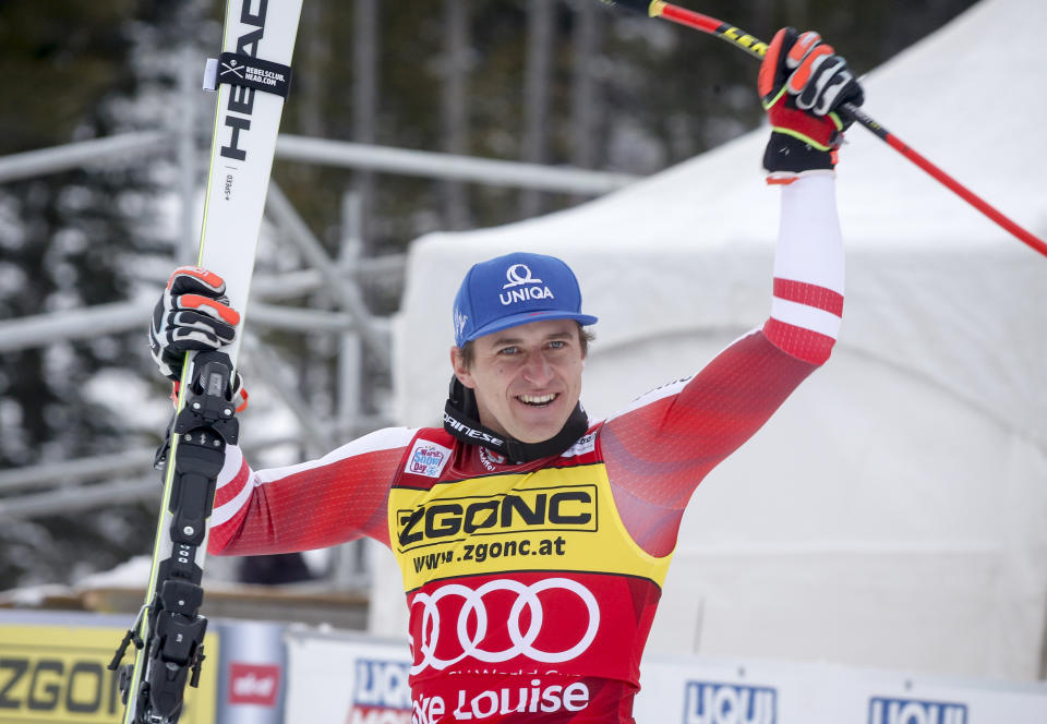 Austria's Matthias Mayer celebrates winning the men's World Cup downhill ski race in Lake Louise, Alberta, Saturday, Nov. 27, 2021. (Jeff McIntosh/The Canadian Press via AP)