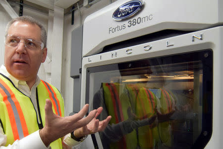 Ford Motor Co global operations president Joe Hinrichs shows off a 3D printer at Ford's Kentucky Truck Plant as the No. 2 U.S. automaker ramps up production of two large SUV models in Louisville, Kentucky, U.S., February 9, 2018. REUTERS/Nick Carey