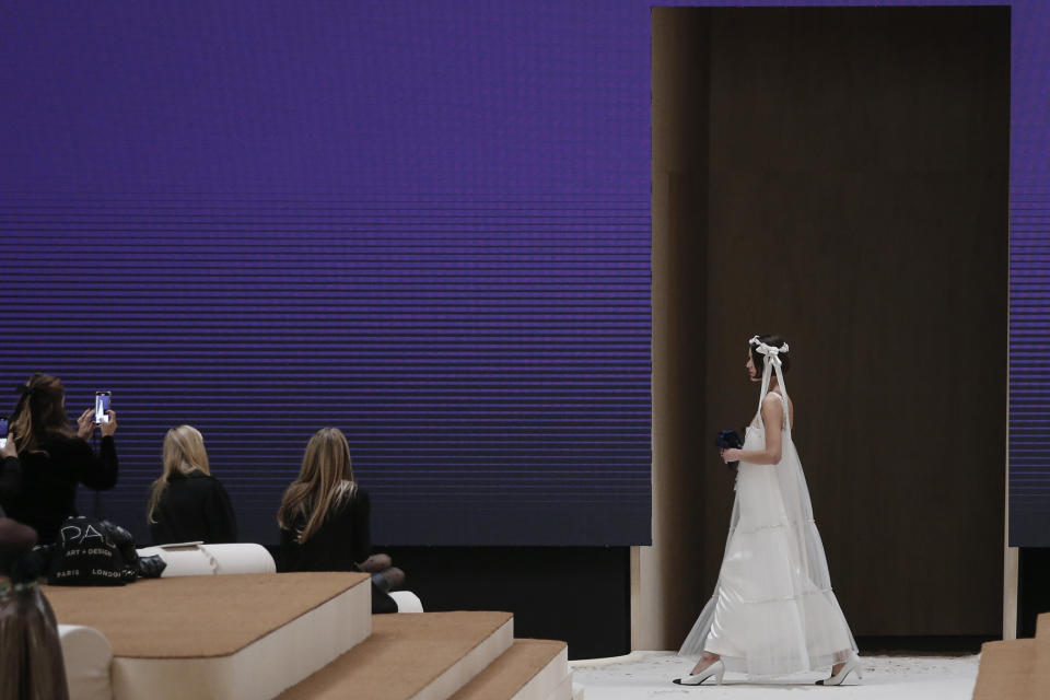 A model wears a creation for the Chanel Spring-Summer 2022 Haute Couture fashion collection collection, in Paris, Tuesday, Jan. 25, 2022. (AP Photo/Lewis Joly)