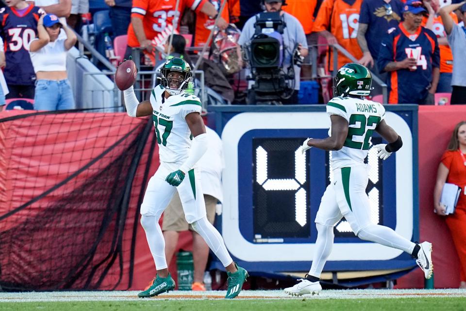 New York Jets cornerback Bryce Hall celebrates after scoring on a fumble recovery against the Denver Broncos during the second half of an NFL football game Sunday, Oct. 8, 2023, in Denver. (AP Photo/Jack Dempsey)