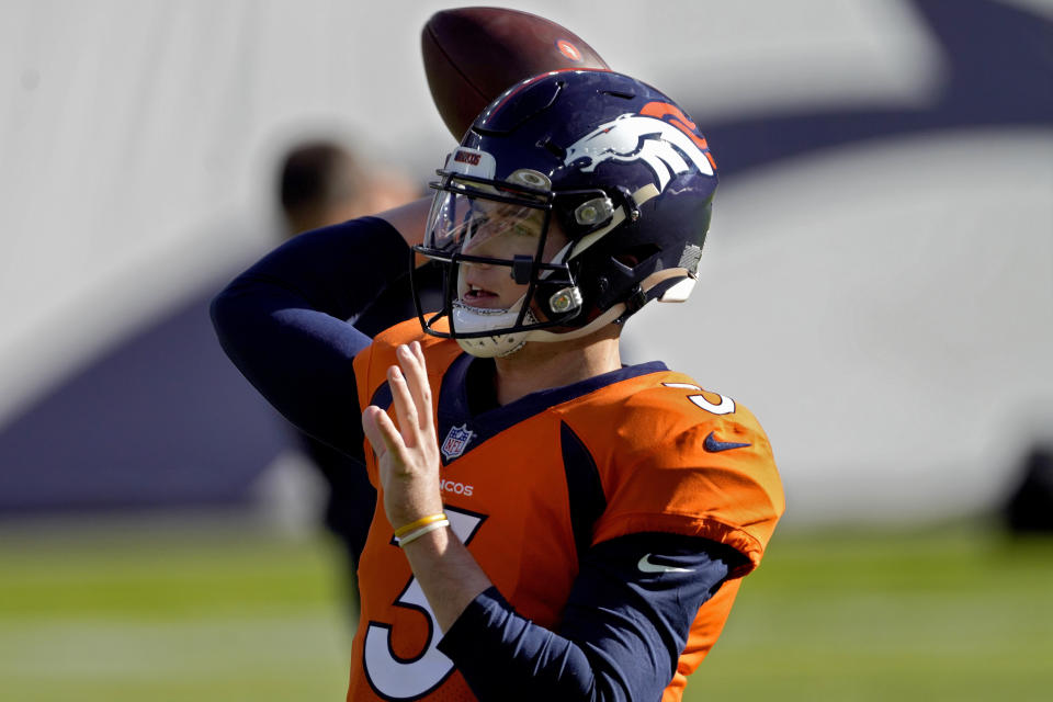 Denver Broncos quarterback Drew Lock (3) warms up prior to an NFL football game against the Miami Dolphins, Sunday, Nov. 22, 2020, in Denver. (AP Photo/Jack Dempsey)