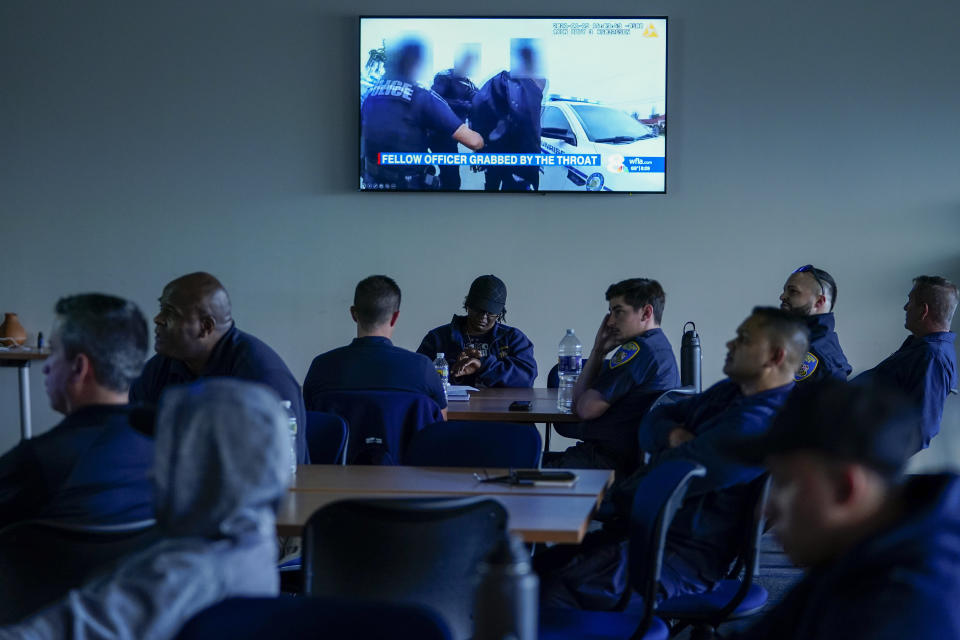 Members of the Baltimore Police Department engage in an exercise during a professional development class, Thursday, Sept. 28, 2023, in Baltimore. As law enforcement agencies across the country pursue reform measures, the Baltimore Police Department is requiring its members to complete a program on emotional regulation that teaches them the basics of brain science by examining the relationship between thoughts, feelings and actions. (AP Photo/Julio Cortez)