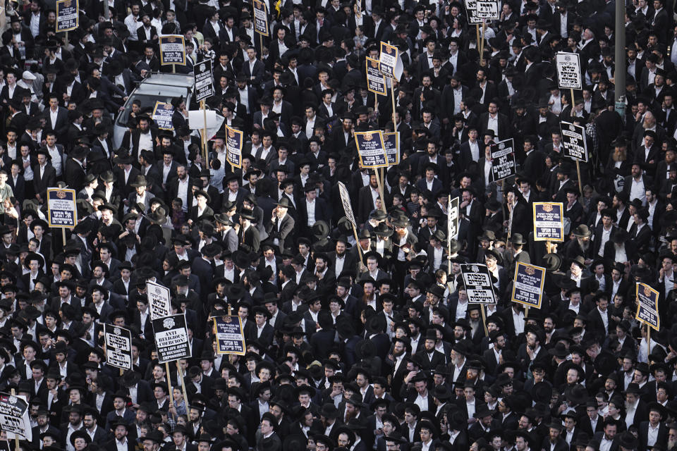 Ultra-Orthodox Jewish men protest against army recruitment, in Jerusalem, Thursday, April 11, 2024. Ultra-Orthodox men have long received exemptions from military service, which is compulsory for most Jewish men, generating widespread resentment. The Supreme Court has ordered the government to present a new proposal to force more religious men to enlist. (AP Photo/Ohad Zwigenberg)