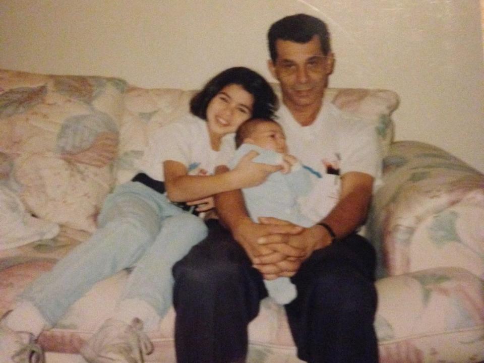 Rima Fakih Slaiby as a child with her father and baby sibling