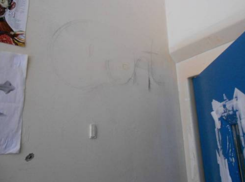 <p>Offensive writing on one of the walls. (Life in prison: Living conditions report) </p>