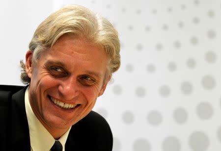 FILE PHOTO: Oleg Tinkov, Chairman of Tinkoff Credit Systems, smiles during an interview with Reuters journalists in Moscow, Russia September 25, 2012. REUTERS/William Webster/File Photo