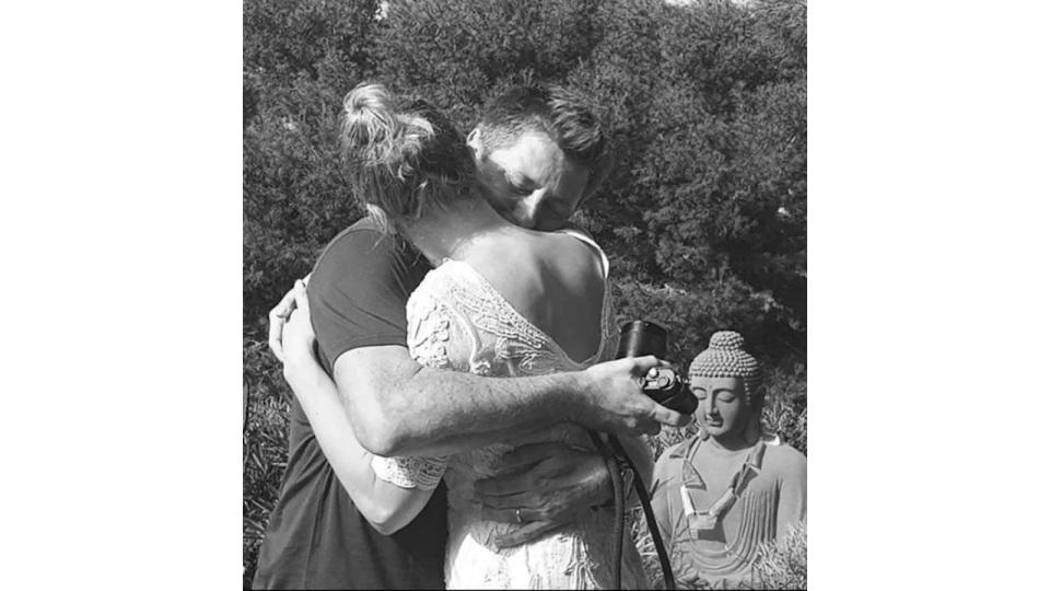 George Clarke hugging wife Katie on their wedding day