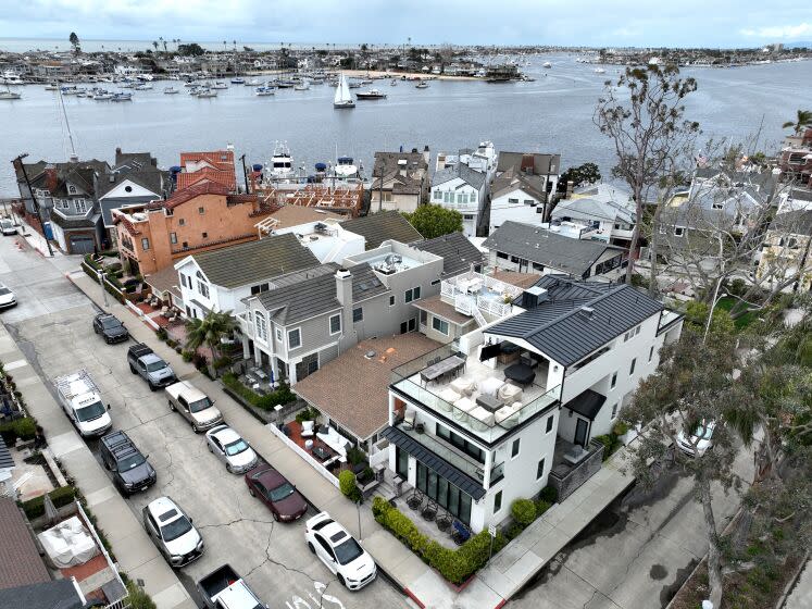 Newport Beach, CA - March 23: A view of a home at right that is under fractional home ownership and has had many noise complaints in the past in Newport Beach Thursday, March 23, 2023. In Newport Beach, residents are mobilizing against fractional home ownership, a spin on the traditional timeshare, where multiple people own a single home and use it on a rotating basis. City leaders are struggling to figure out how to deal with these properties, which neighbors say have become a nuisance in the neighborhood and lower the already limited housing stock for people who want to live in the community full-time. Cities across California, including in wine country and the central coast, have banned them or are trying to regulate them. (Allen J. Schaben / Los Angeles Times)