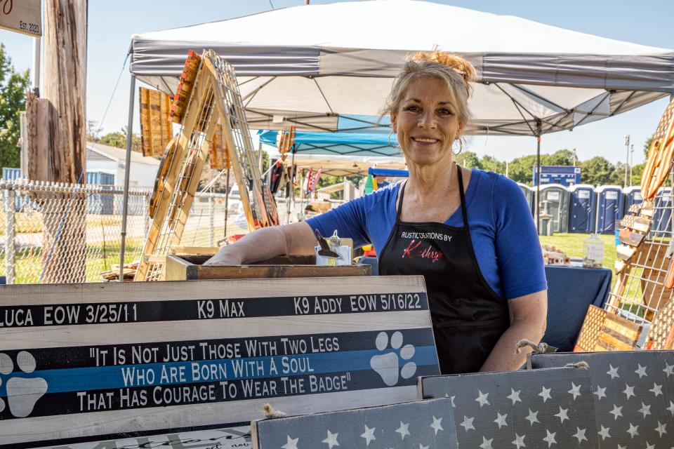 Kathryn Prioli, of Braintree, was at Braintree Day on Saturday, June 25, 2022 with a sign she made dedicated to K-9s who died.