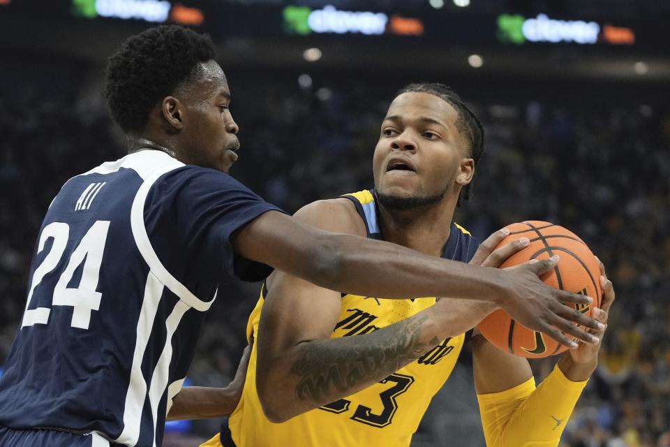 Marquette's David Joplin tries to get past Butler's Ali Ali during the first half of an NCAA college basketball game Saturday, Feb. 4, 2023, in Milwaukee. (AP Photo/Morry Gash)