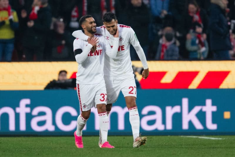 Cologne's Linton Maina (L) and goalscorer Davie Selke celebrate after scoring his side's first goal of the game during the German Bundesliga soccer match between 1. FC Cologne and 1. FC Heidenheim at RheinEnergieStadion. Marius Becker/dpa