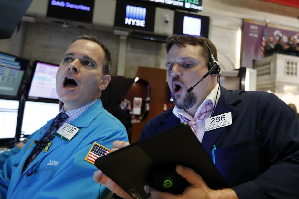 Specialist John Alatzas, left, and trader Michael Milano work on the floor of the New York Stock Exchange, Wednesday, May 1, 2019. Stocks are opening higher on Wall Street after several big U.S. companies reported earnings that were better than analysts were expecting. (AP Photo/Richard Drew)