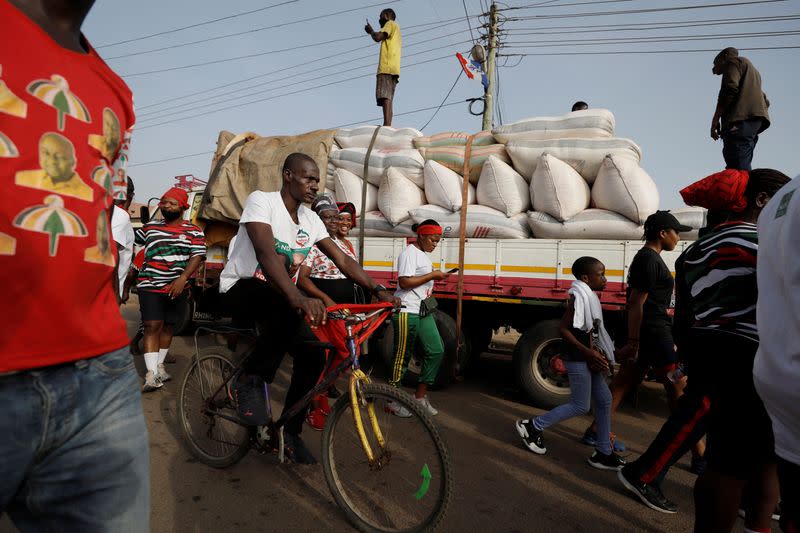 Supporters of the opposition National Democratic Congress partake in an organized community health walk in Accra