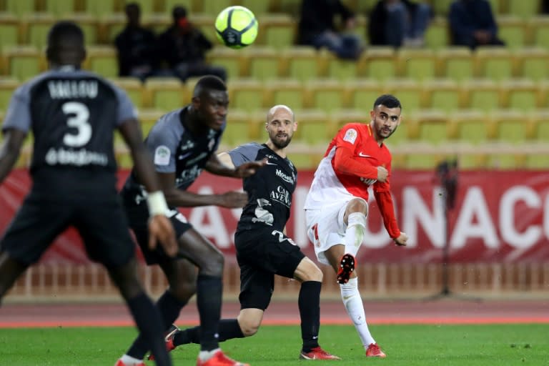 Monaco's midfielder Rachid Ghezzal (R) shoots to score a goal against Metz on January 21, 2018 at the Louis II Stadium in Monaco