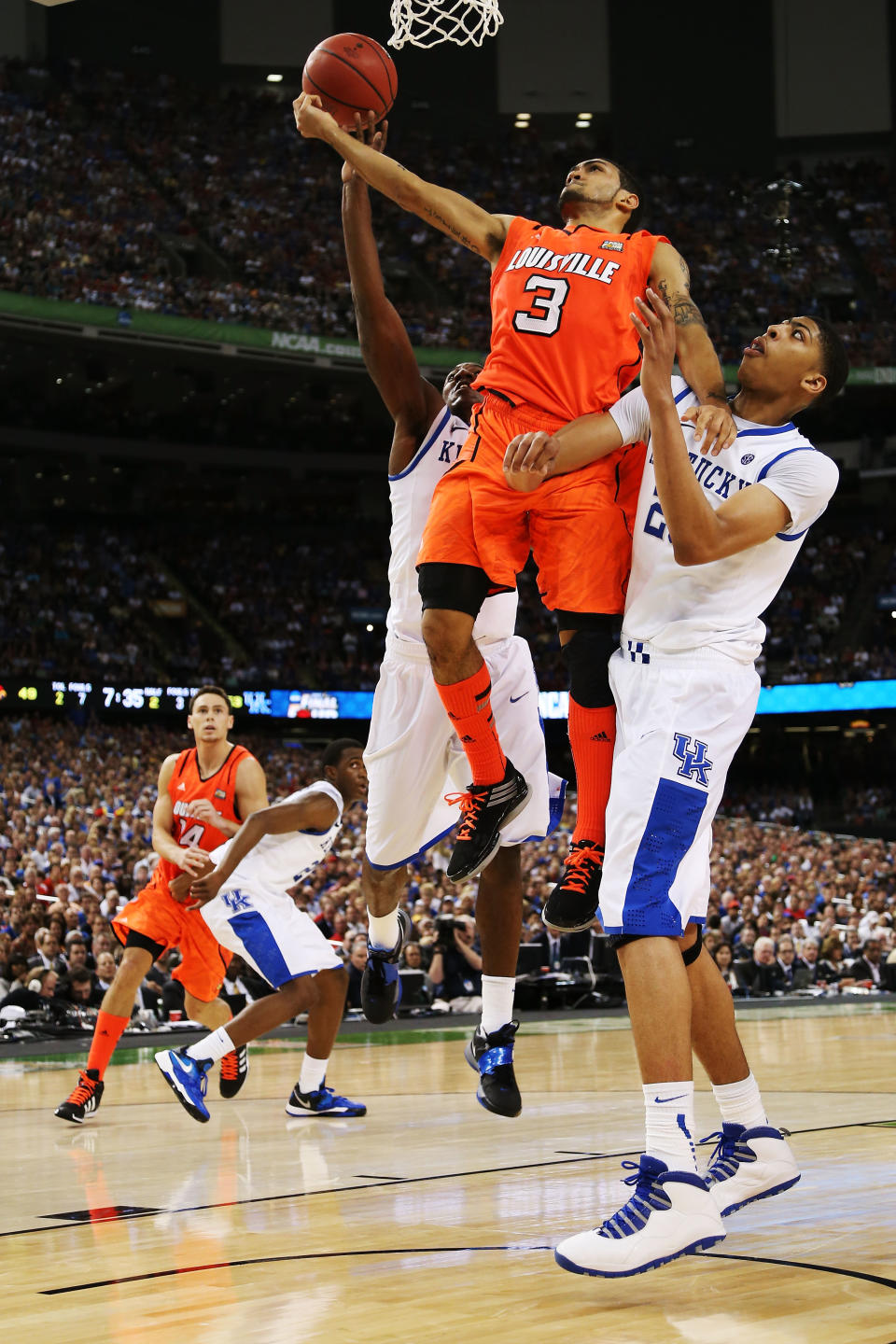 NEW ORLEANS, LA - MARCH 31: Peyton Siva #3 of the Louisville Cardinals goes up for a shot against Anthony Davis #23 of the Kentucky Wildcats in the second half during the National Semifinal game of the 2012 NCAA Division I Men's Basketball Championship at the Mercedes-Benz Superdome on March 31, 2012 in New Orleans, Louisiana. (Photo by Chris Graythen/Getty Images)