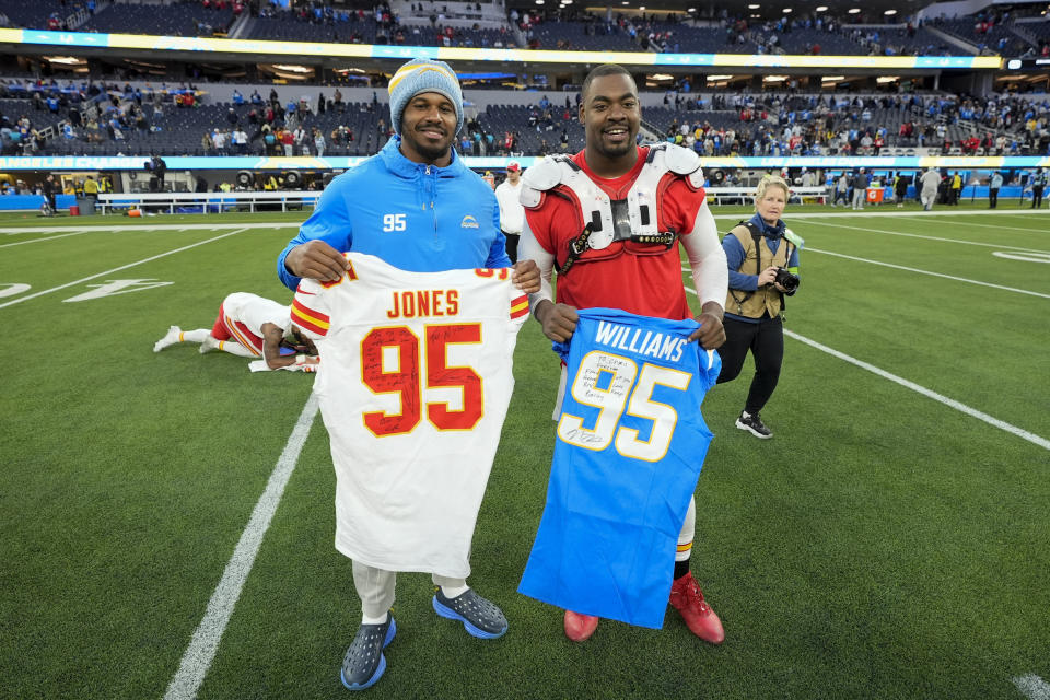 Kansas City Chiefs defensive tackle Chris Jones, right, trades jerseys with Los Angeles Chargers defensive tackle Nick Williams after the Chiefs defeated the Chargers 13-12 in an NFL football game, Sunday, Jan. 7, 2024, in Inglewood, Calif. (AP Photo/Mark J. Terrill)