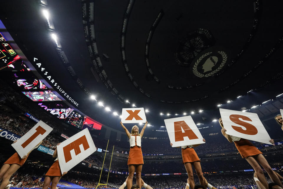 FILE - Texas cheerleaders perform during the first half of the Sugar Bowl CFP NCAA semifinal college football game against Washington, Monday, Jan. 1, 2024, in New Orleans. (AP Photo/Gerald Herbert, File)