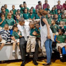 #11 Kissing kids photobomb Obama<br> During his 2012 campaign, President Obama surprised students in Delray Beach, Fla., with an unscheduled stop to take a photo with the kids. But perhaps the biggest surprise of this photo op was the kissing pair in the back row photobombing the president.