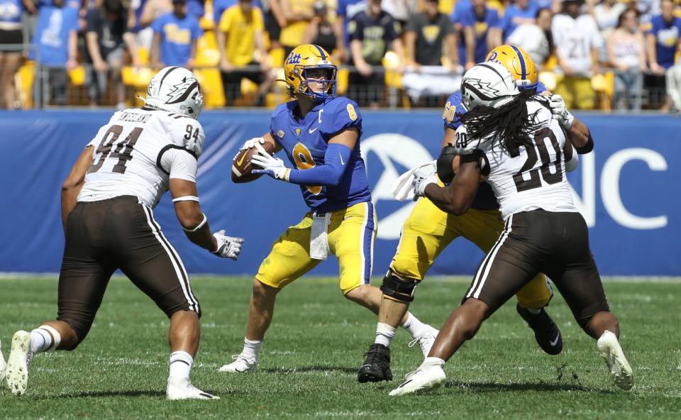 Sep 18, 2021; Pittsburgh, Pennsylvania, USA;  Pittsburgh Panthers quarterback Kenny Pickett (8) looks to pass against the Western Michigan Broncos during the second quarter at Heinz Field. Mandatory Credit: Charles LeClaire-USA TODAY Sports