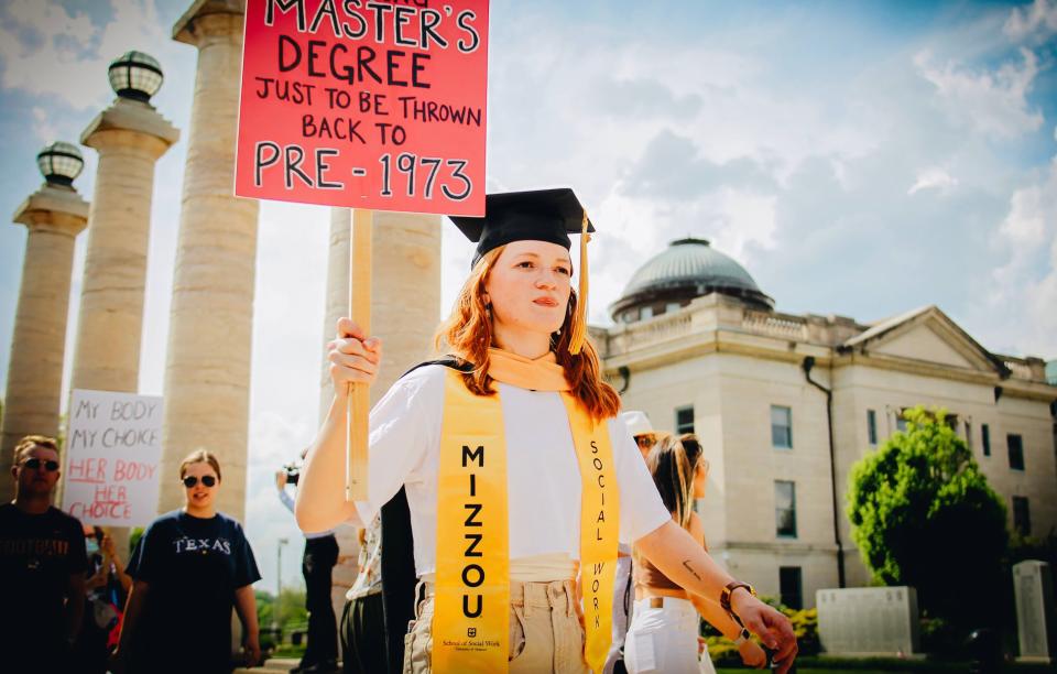 Jodie Ashby, a graduate of the master's program at the School of Social Work at the University of Missouri, stands near the Boone County Courthouse on Saturday during a rally for reproductive rights.