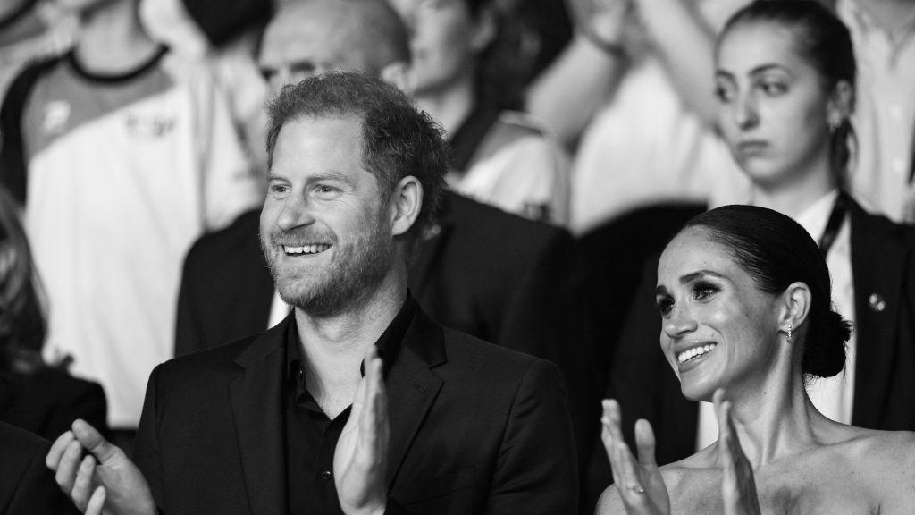 prince harry and meghan markle at the invictus games in black and white