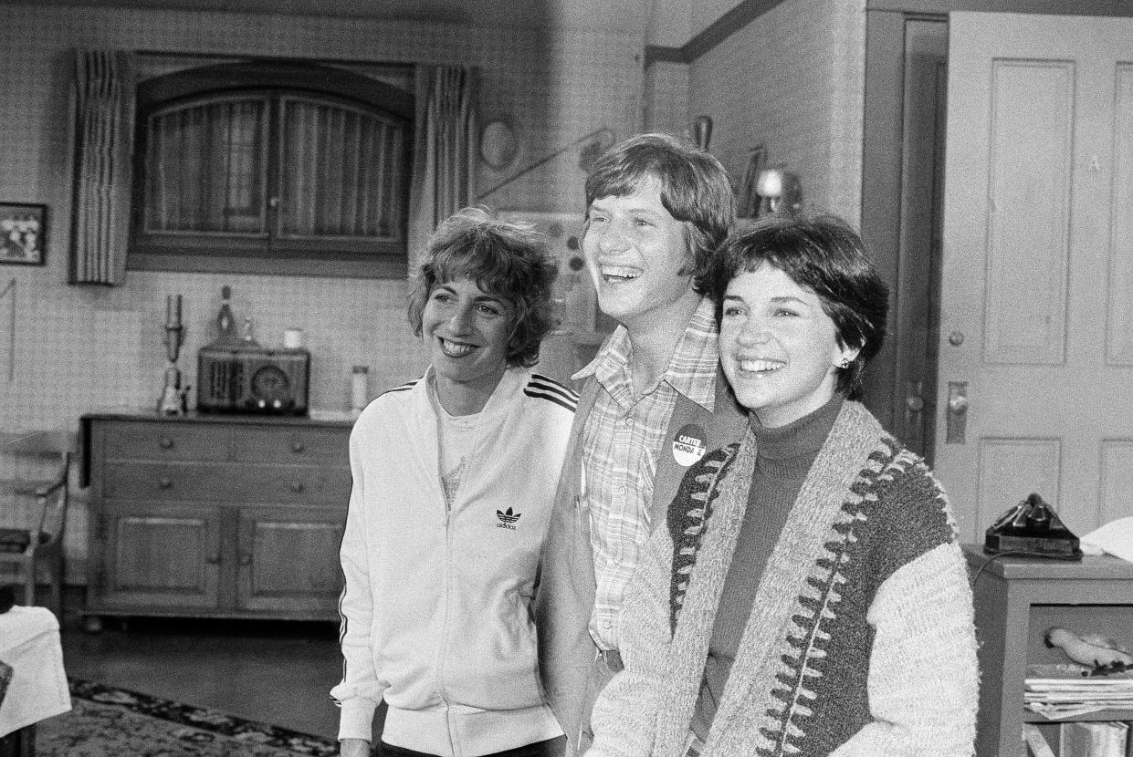FILE - Chip Carter, son of Democratic presidential candidate Jimmy Carter, poses with Penny Marshall, left, and Cindy Williams, right, on the set of the sitcom "Laverne and Shirley" at the Paramount Studios in Los Angeles, Sept. 21, 1976. Williams, who played Shirley opposite Marshall's Laverne on the popular sitcom, died Wednesday, Jan. 25, 2023, in Los Angeles at age 75, her family said Monday, Jan. 30. (AP Photo/David F. Smith, File)