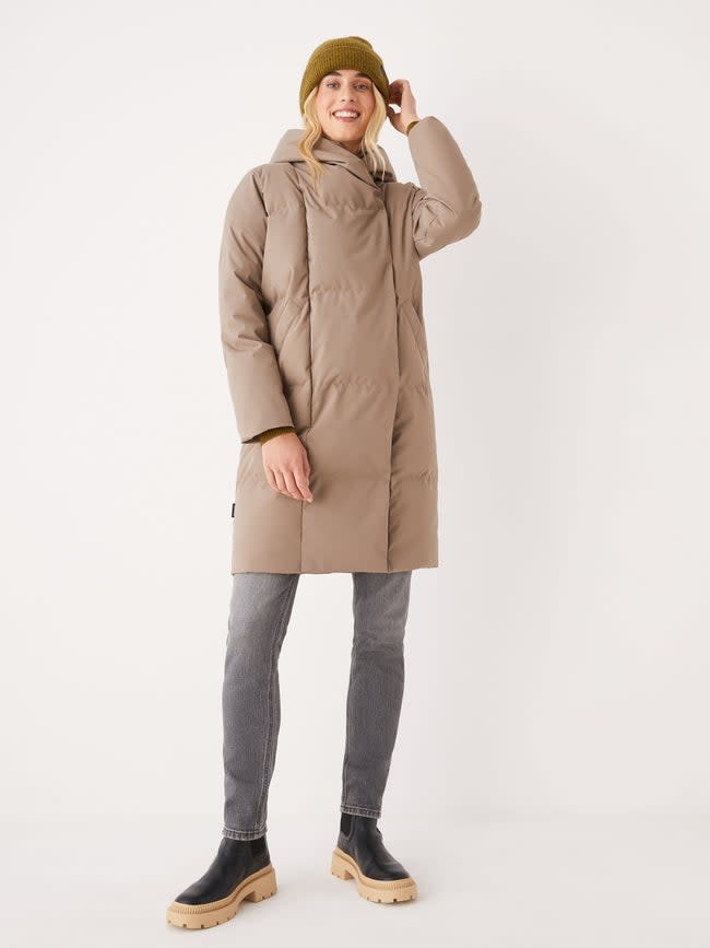 Model wears The Hygge Puffer Coat in tan