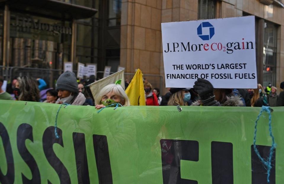 A protester in front of J.P. Morgan bank