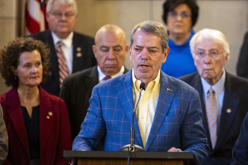 Gov. Jim Pillen is joined by state senators as he announces that the state will participate in the Summer Electronic Benefits Transfer Program after previously saying Nebraska wouldn't take part during a press conference in the Warner Chamber at the Capitol, Monday, Feb. 12, 2024, in Lincoln, Neb. (Kenneth Ferriera/Lincoln Journal Star via AP)