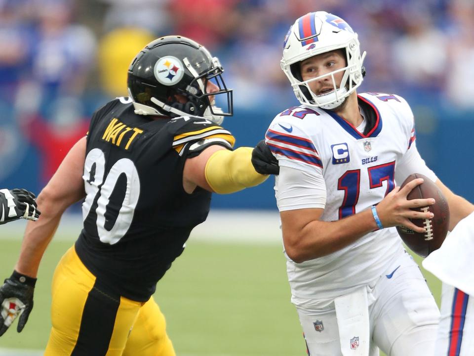 Josh Allen evades T.J. Watt.