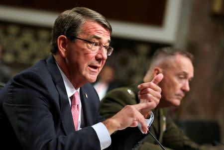 U.S. Defense Secretary Ash Carter (L) and Chairman of the Joint Chiefs of Staff Joseph Dunford testify before a Senate Armed Services Committee hearing on National Security Challenges and Ongoing Military Operations on Capitol Hill in Washington, U.S., September 22, 2016. REUTERS/Yuri Gripas