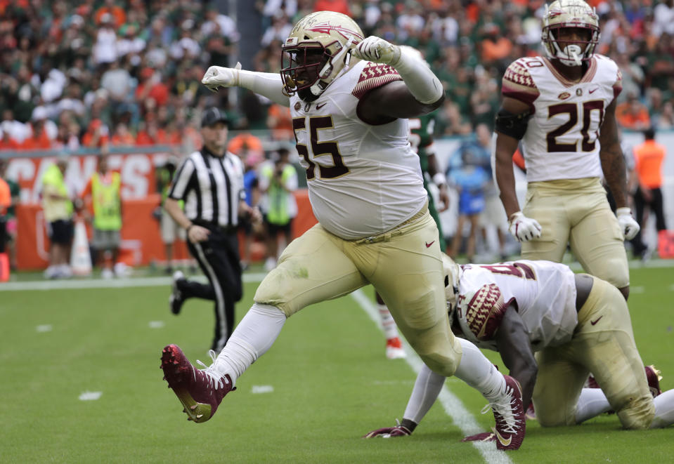 Florida State defensive tackle Fredrick Jones (55) celebrates after tackling Miami running back DeeJay Dallas during the first half of an NCAA college football game, Saturday, Oct. 6, 2018, in Miami Gardens, Fla. (AP Photo/Lynne Sladky)