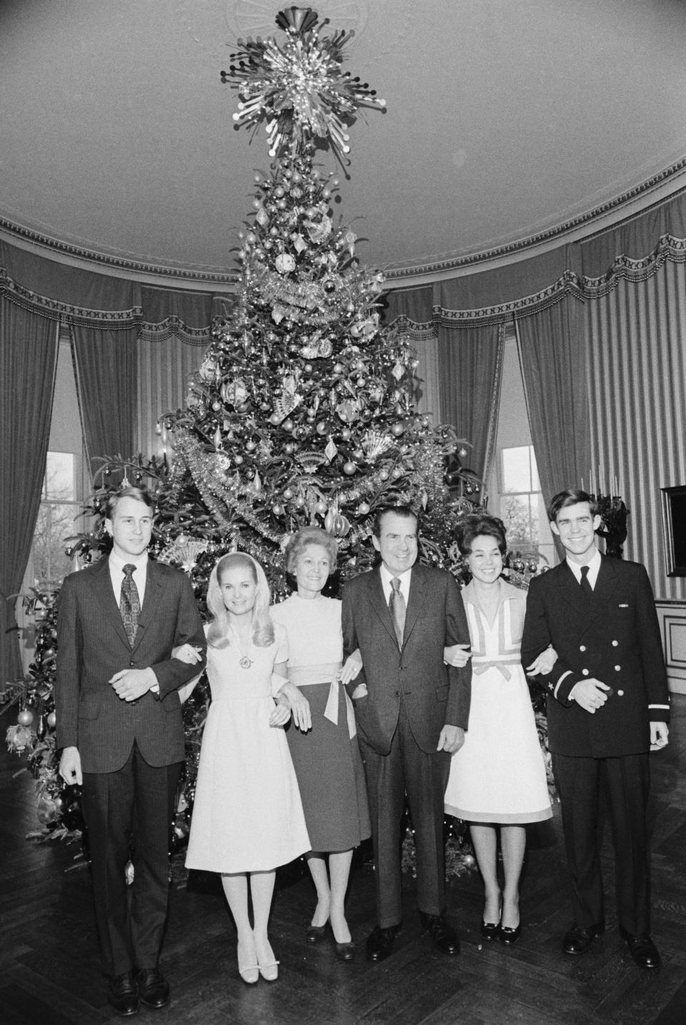 The Nixon family poses in front of a Christmas tree at the White House in 1971.