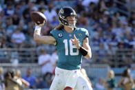 FILE - Jacksonville Jaguars quarterback Trevor Lawrence (16) throws a pass during the second half of an NFL football game against the Indianapolis Colts, Sunday, Jan. 9, 2022, in Jacksonville, Fla. Jacksonville, which chose Clemson quarterback Lawrence last year and is expected to add Michigan pass rusher Aidan Hutchinson, Georgia's Travon Walker or an offensive tackle next, is looking to become the first to say it nailed both selections. (AP Photo/Phelan M. Ebenhack, File)