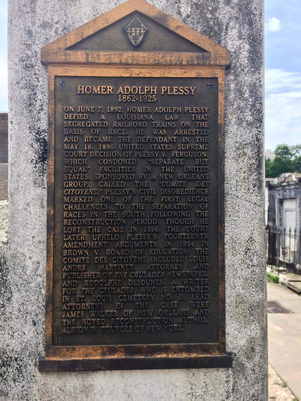 This June 3, 2018 photo shows a marker on the burial site for Homer Plessy at St. Louis No. 1 Cemetery in New Orleans. Plessy, the namesake of the U.S. Supreme Court’s 1896 “separate but equal” ruling, is being considered for a posthumous pardon. The Creole man of color died with a conviction still on his record for refusing to leave a whites-only train car in New Orleans in 1892.