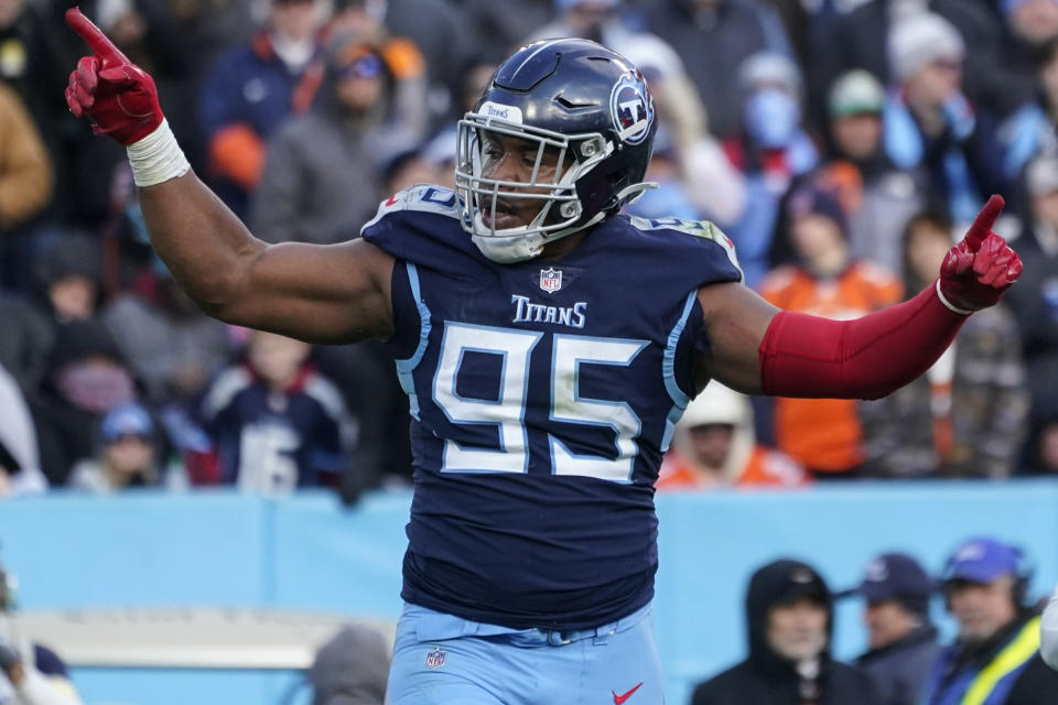 Tennessee Titans defensive end DeMarcus Walker (95) celebrates a sack of Denver Broncos quarterback Russell Wilson during the second half of an NFL football game, Sunday, Nov. 13, 2022, in Nashville, Tenn. (AP Photo/Mark Humphrey)