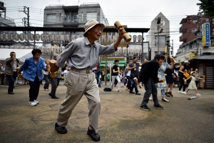 Elderly and middle-aged people practice physical activity with wooden dumbbells during an event marking the 'Respect-for-the-Aged' Day in Tokyo, Japan, on September 19, 2016. According to government data released on 13 September, the number of Japanese people aged 100 or older reached a record figure of 65,692 in September, with nearly 88 per cent of the centenarians being women. (Franck Tobichon/EPA)