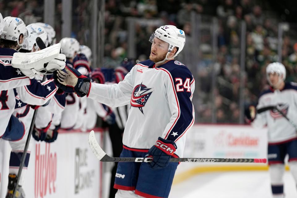 Columbus Blue Jackets right wing Mathieu Olivier (24) celebrates with teammates after scoring a goal against the Minnesota Wild during the first period of an NHL hockey game Sunday, Feb. 26, 2023, in St. Paul, Minn. (AP Photo/Abbie Parr)