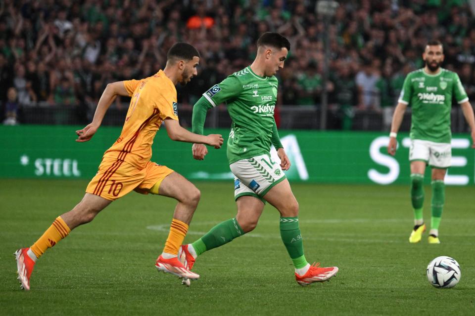 Saint-Etienne midfielder Dylan Chambost (14) wins the ball during a French L2 playoff match against Rodez in May.