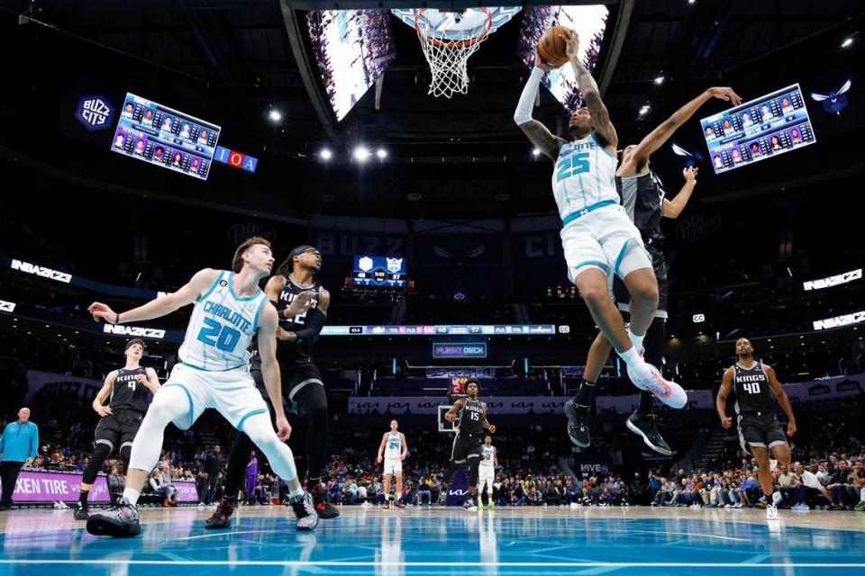 Charlotte Hornets forward P.J. Washington (25) shoots over Sacramento Kings forward Keegan Murray (13) during a game at Spectrum Center in Charlotte, N.C., Monday, Oct. 31, 2022. 