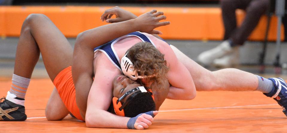 McDowell's Caleb Butterfield, top, pins Cathedral Prep's Jaden Crockett at 160 pounds during the District 10 Class 3A team wrestling tournament at Prep's Hagerty Family Events Center in Erie on Feb. 2. Butterfield is a returning D-10 Class 3A individual champion.