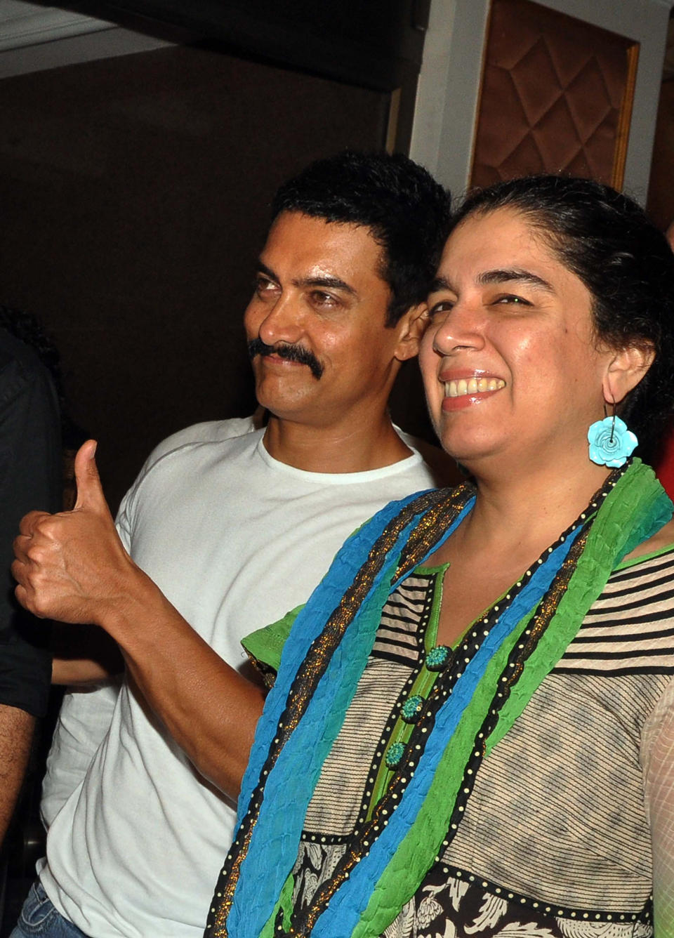 Indian Bollywood film actor Aamir Khan (L) and his first and former wife Reena Dutta attend the tenth anniversary celebration party of Hindi film 'Lagaan' in Mumbai on June 15, 2011.  PHOTO/STR (Photo credit should read STR/AFP via Getty Images)